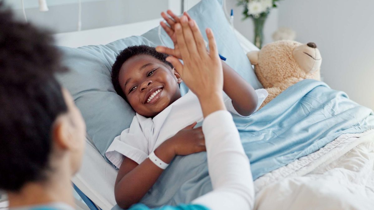 High five, nurse and black child patient in hospital for success of surgery for congenital heart disease. Checkup, sick and cardiology medical worker with African kid in bed for postoperative care.