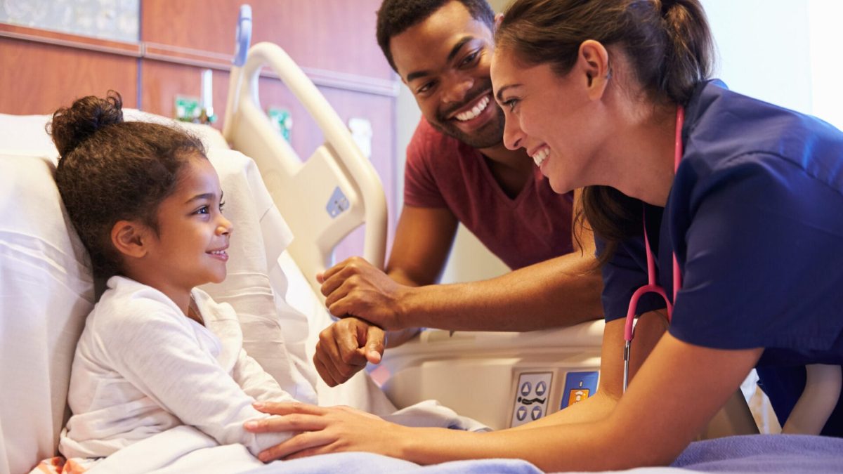 Pediatric surgeon in Los Angeles County checking on a patient.